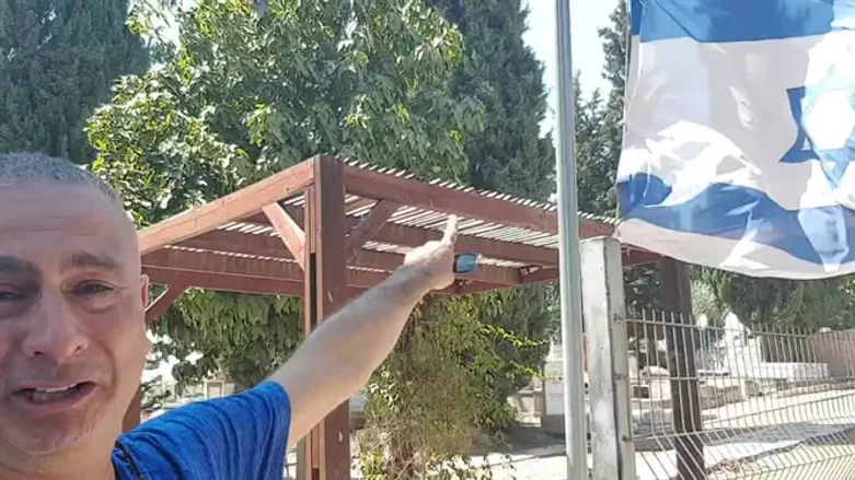 Bereaved father lowers flag to half-mast