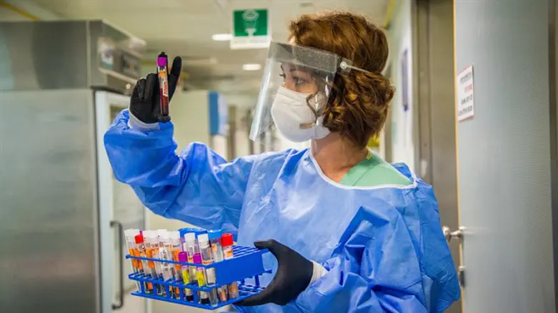 Technician checks COVID-19 tests