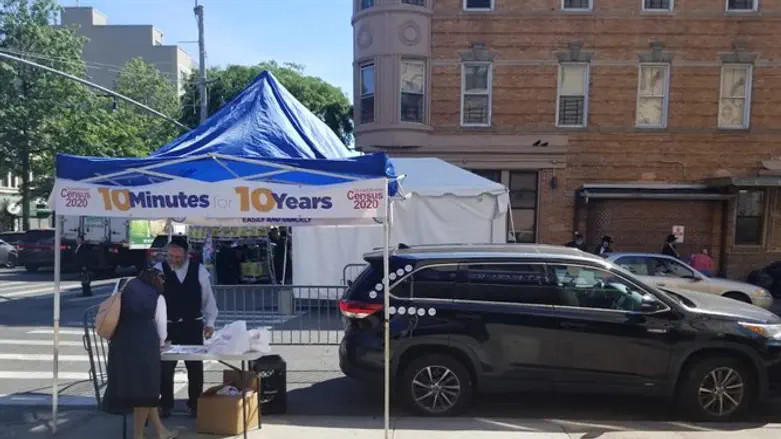 Volunteer distributes information about the census
