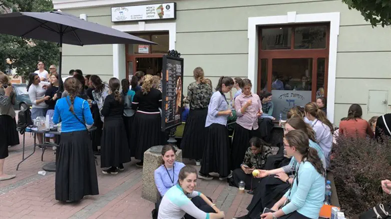 Patrons at The Nosh Kosher Cafe in Tarnow, Poland, pre-pandemic.