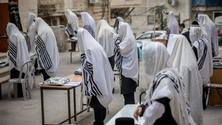 Worshippers pray outside during coronavirus crisis