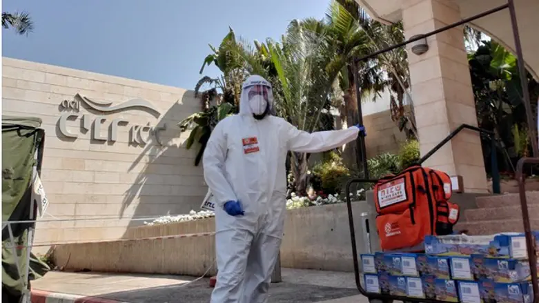 volunteers preparing equipment at the Kinar Hotel