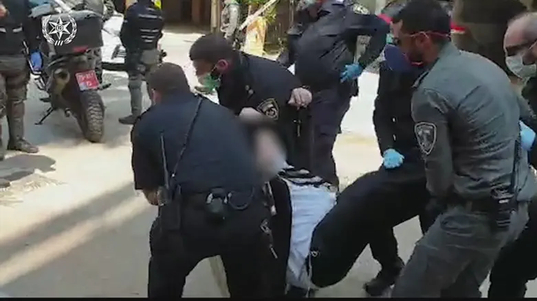 Police arresting quarantine violator