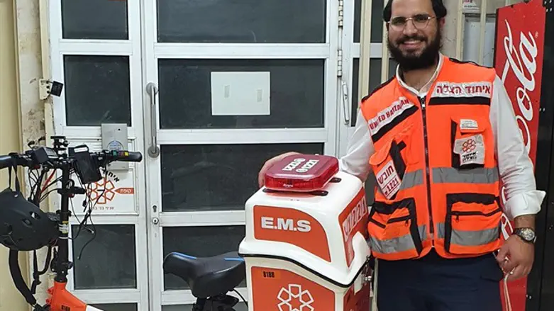 Shlomo Toledano with his electric bicycle outside the Bnei Brak Chapter house