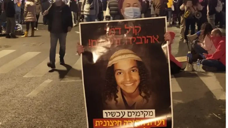 Writer with Ahuvia poster at Balfour St.