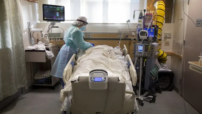 A nurse works with a COVID patient in Fullerton, Calif., Dec. 25, 2020.